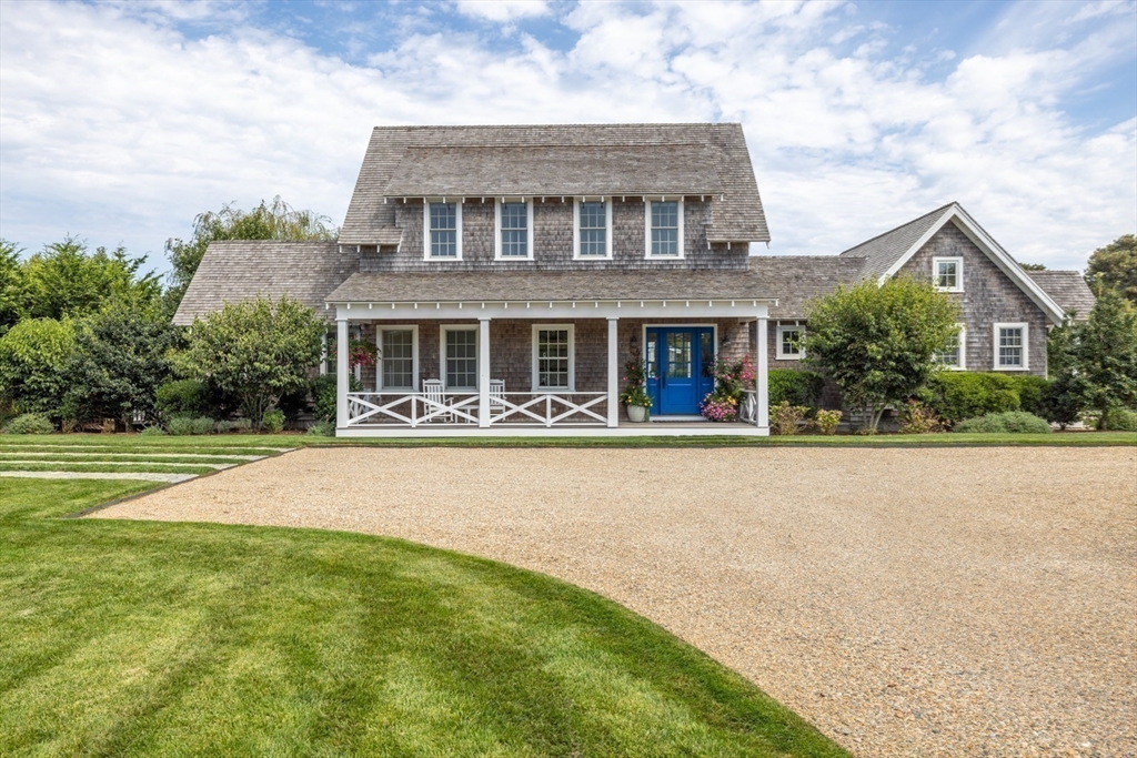 106 A Surfside Road, Unit EAST Nantucket, MA 02554 - Photo 41 of 42 a front view of house with yard and lake view