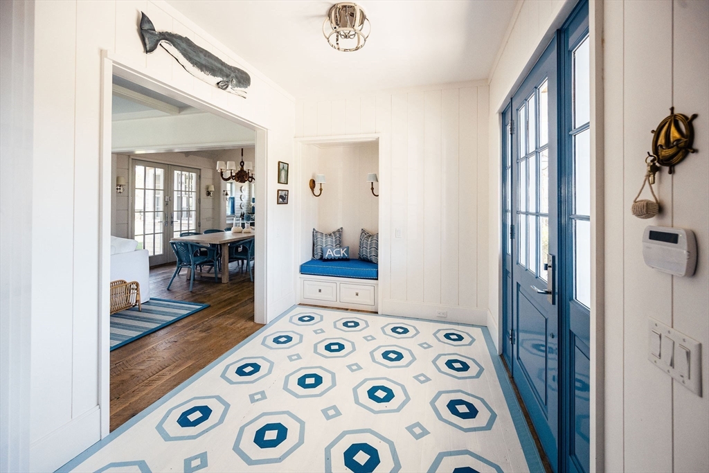 106 A Surfside Road, Unit EAST Nantucket, MA 02554 - Photo 9 of 42 a bedroom with furniture and a window