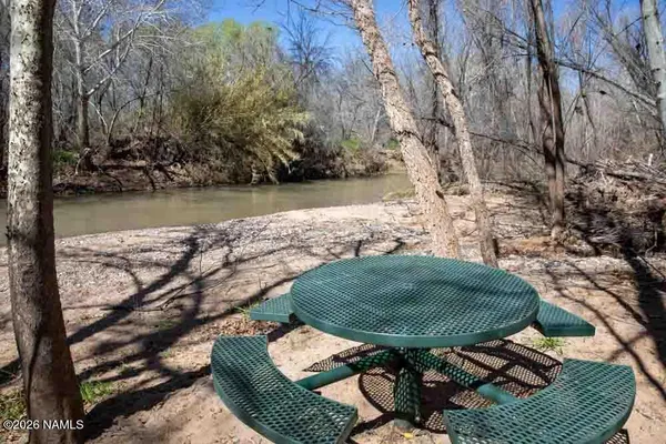 a view of a chairs and table in the patio