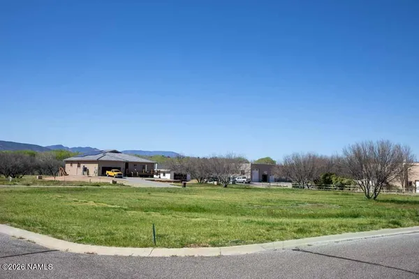a view of an house with a big yard