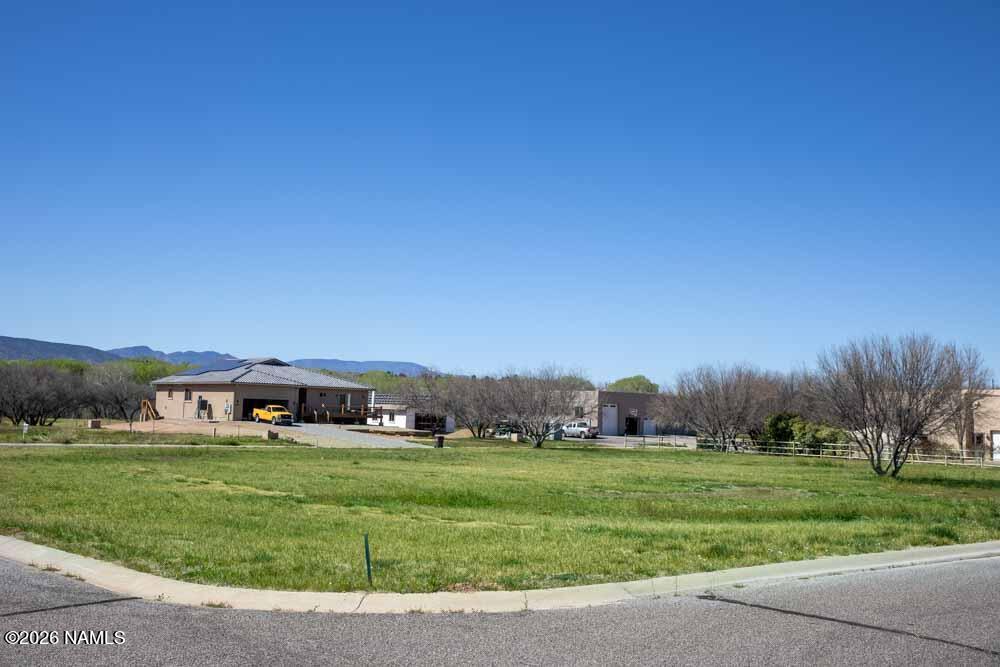 1097 Amber Way Camp Verde, AZ 86322 - Photo 4 of 22 a view of an house with a big yard