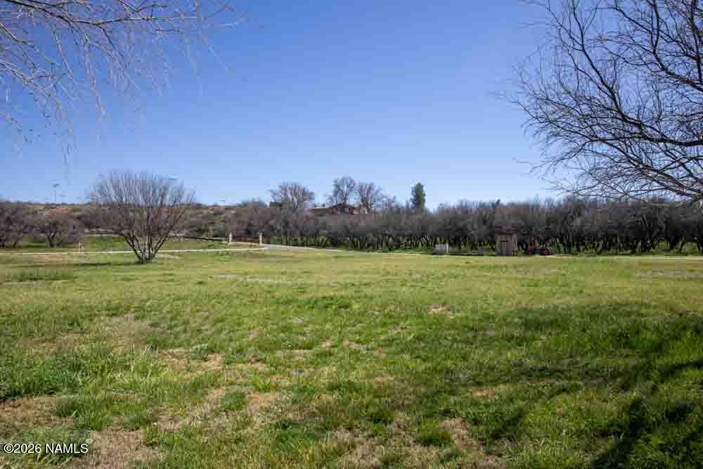 1097 Amber Way Camp Verde, AZ 86322 - Photo 6 of 22 a view of field with trees in the background
