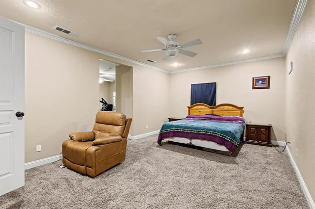 a bedroom with furniture and a lamp