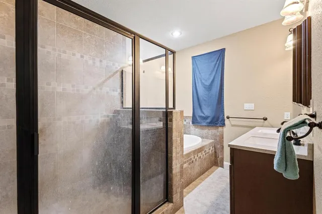 a bathroom with a double vanity sink and mirror