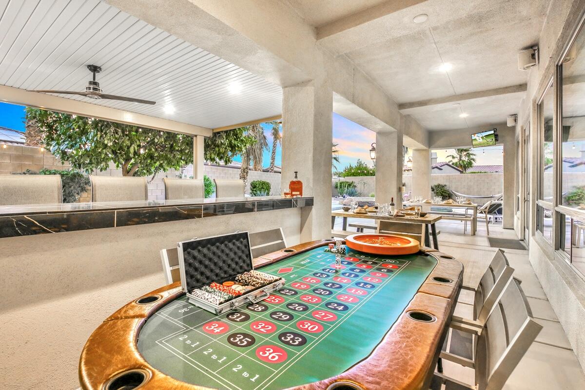 48713 Spring Rain Court Indio, CA 92201 - Photo 15 of 66 a room with furniture and a wooden floor