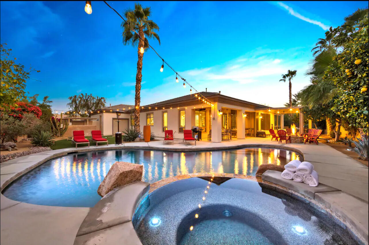 48713 Spring Rain Court Indio, CA 92201 - Photo 2 of 66 a view of swimming pool with outdoor seating
