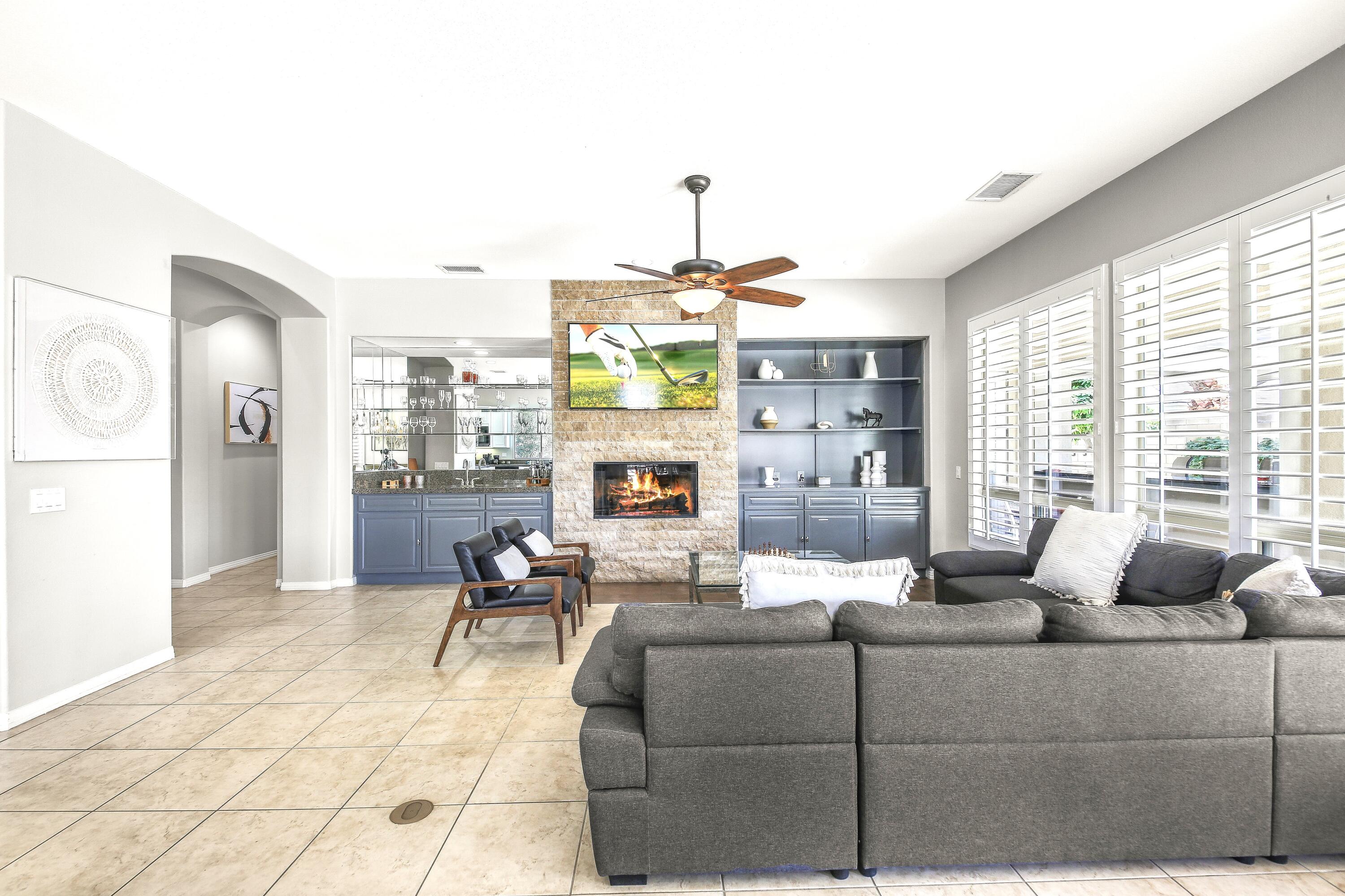 48713 Spring Rain Court Indio, CA 92201 - Photo 23 of 66 a living room with furniture and a fireplace