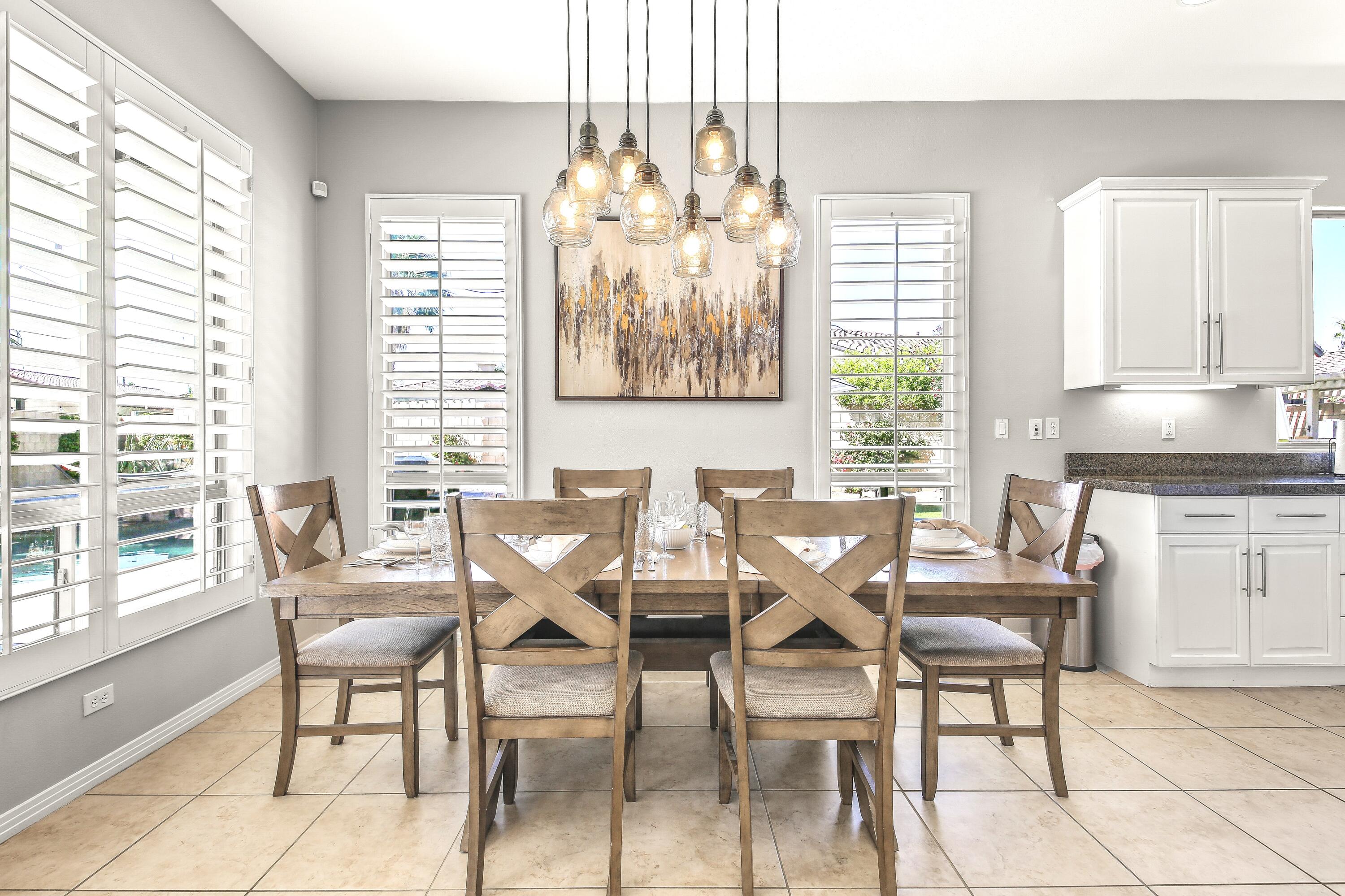 48713 Spring Rain Court Indio, CA 92201 - Photo 28 of 66 a view of a dining room with furniture and a large window