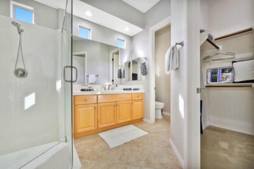 48713 Spring Rain Court Indio, CA 92201 - Photo 41 of 66 a bathroom with a sink double vanity and a shower