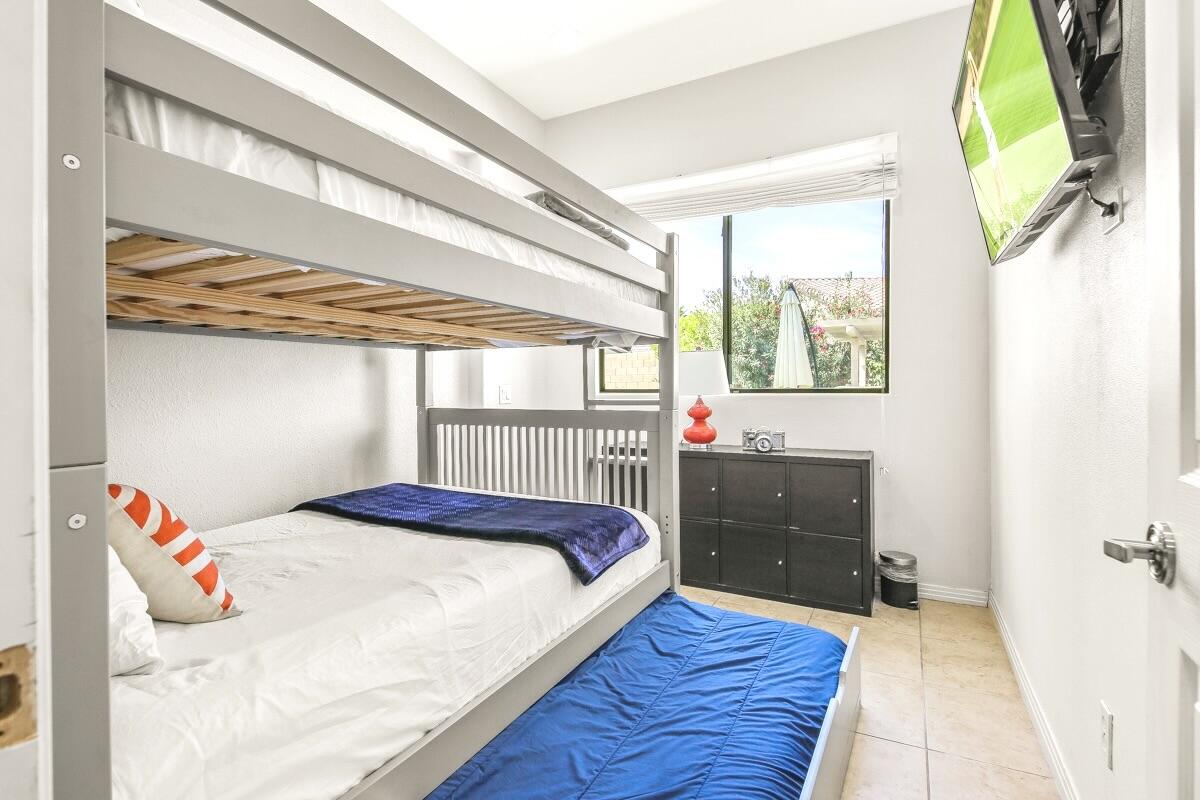 48713 Spring Rain Court Indio, CA 92201 - Photo 45 of 66 a bedroom with a bed and a window