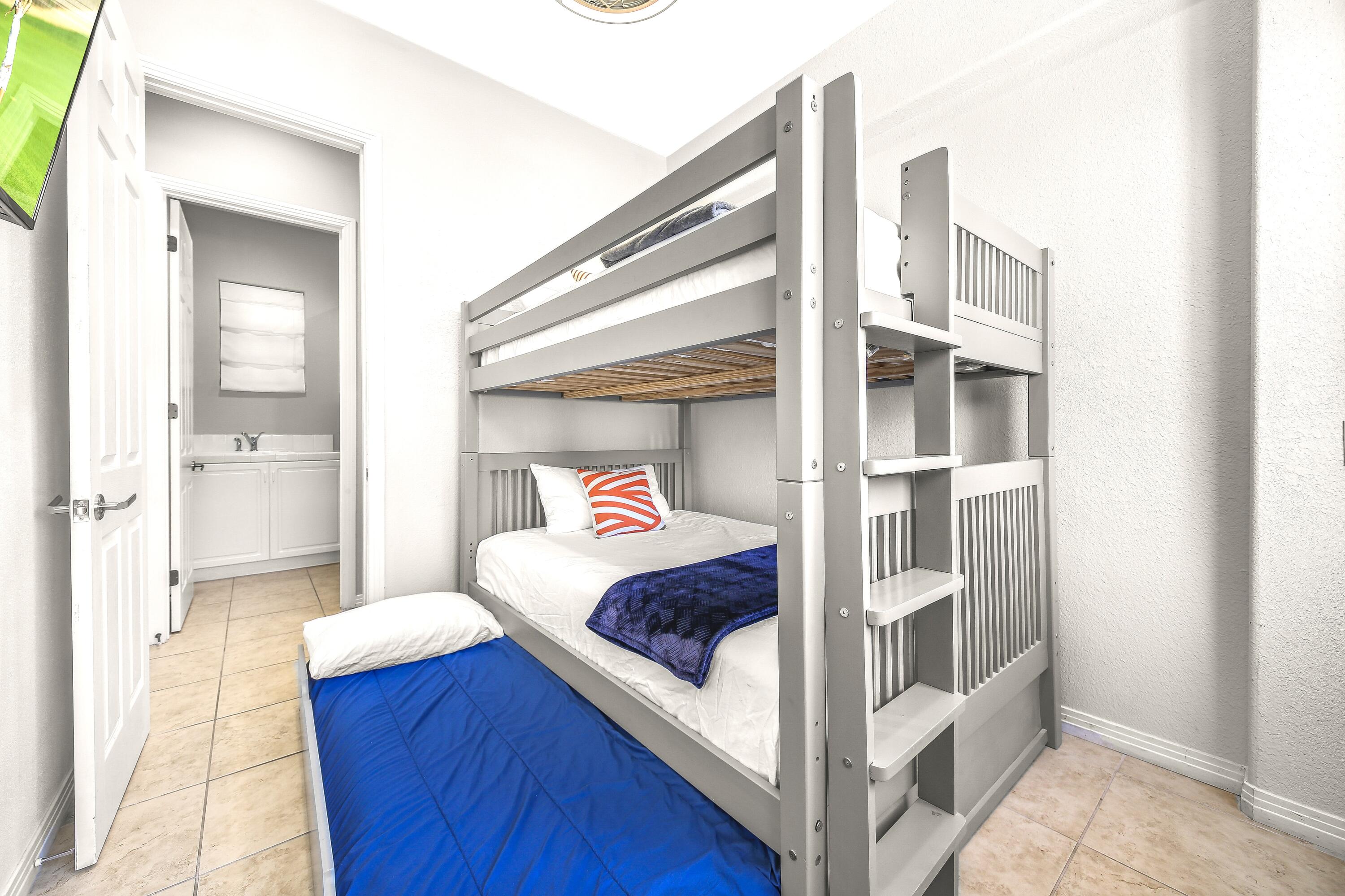 48713 Spring Rain Court Indio, CA 92201 - Photo 46 of 66 a bedroom with a bed and glass door