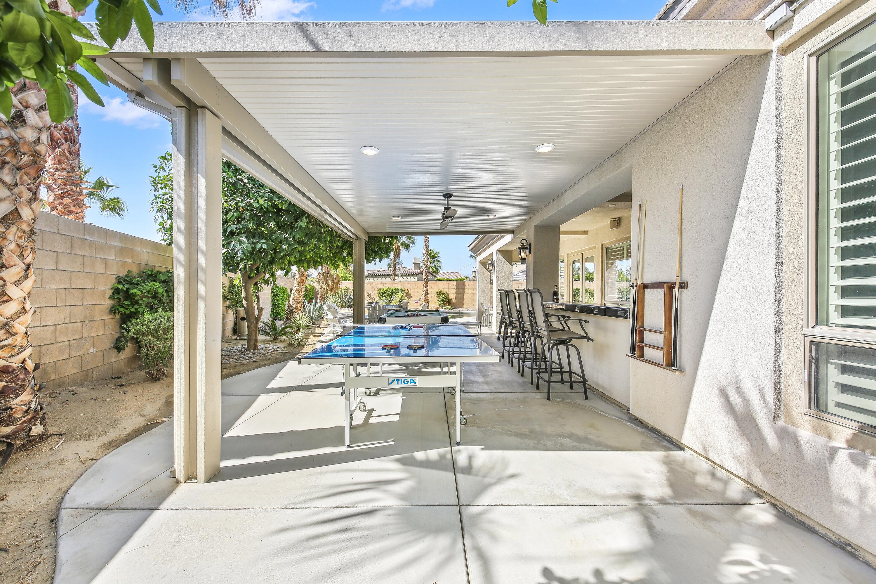 48713 Spring Rain Court Indio, CA 92201 - Photo 52 of 66 a view of a lobby with furniture and floor to ceiling window