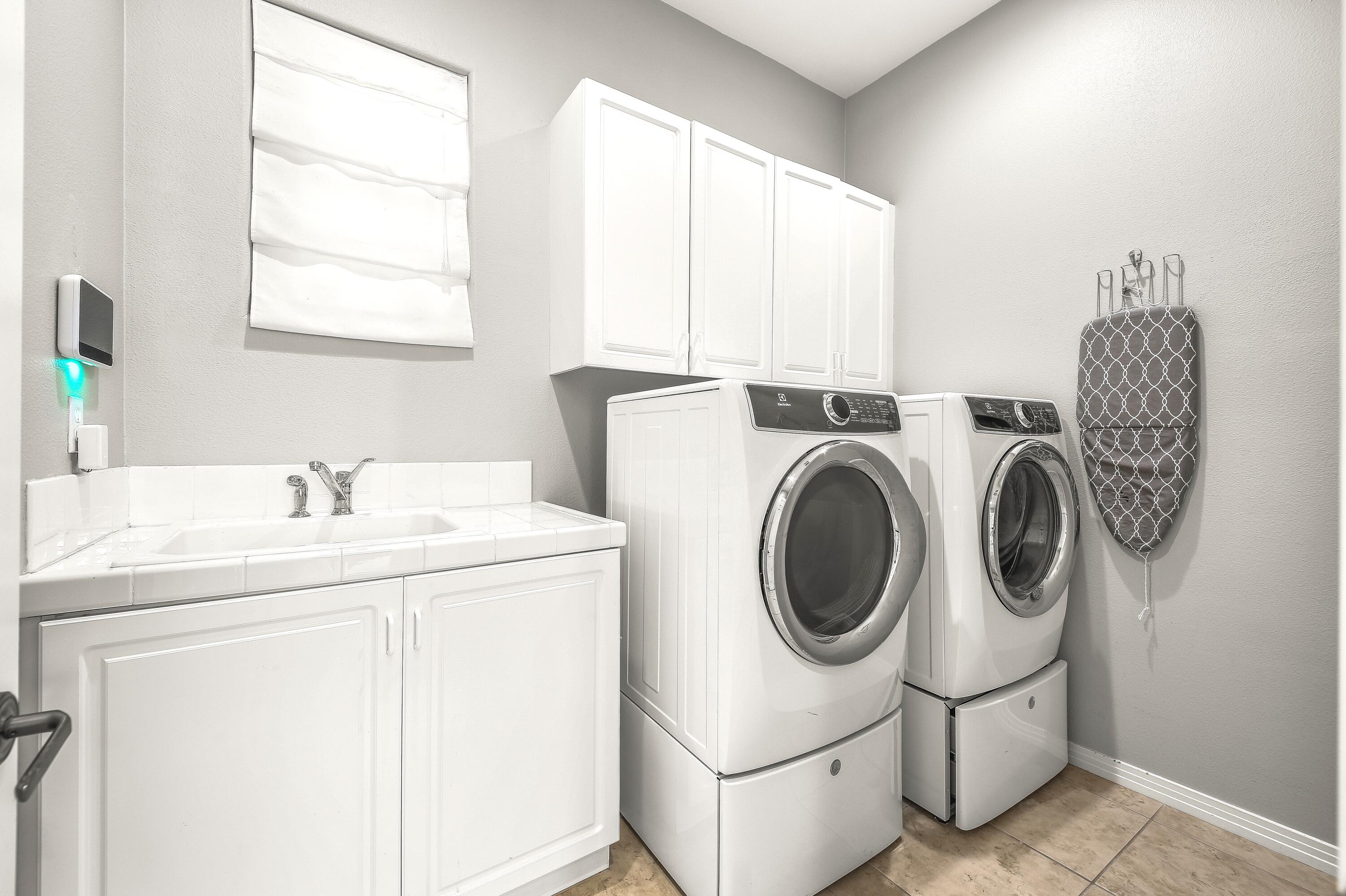 48713 Spring Rain Court Indio, CA 92201 - Photo 54 of 66 a utility room with dryer and washer