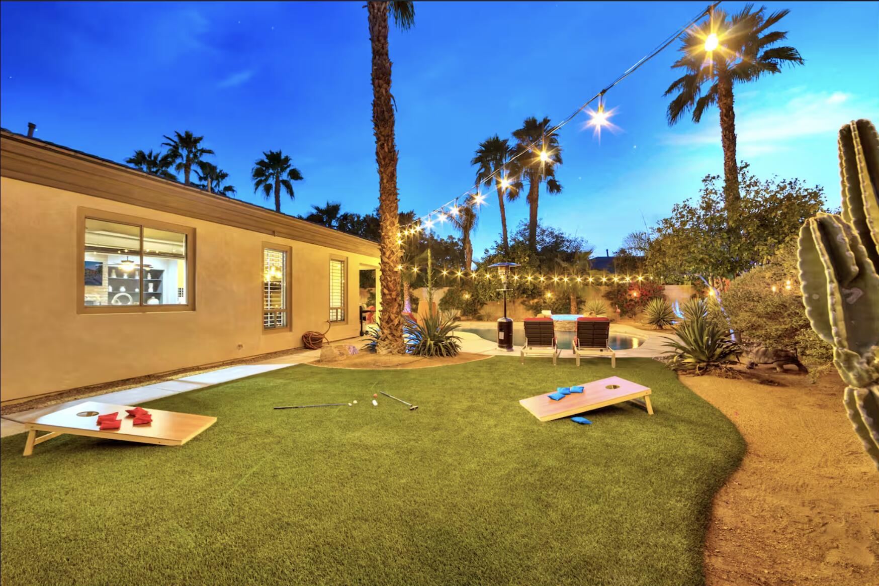 48713 Spring Rain Court Indio, CA 92201 - Photo 57 of 66 a view of a swimming pool with an outdoor space and seating area