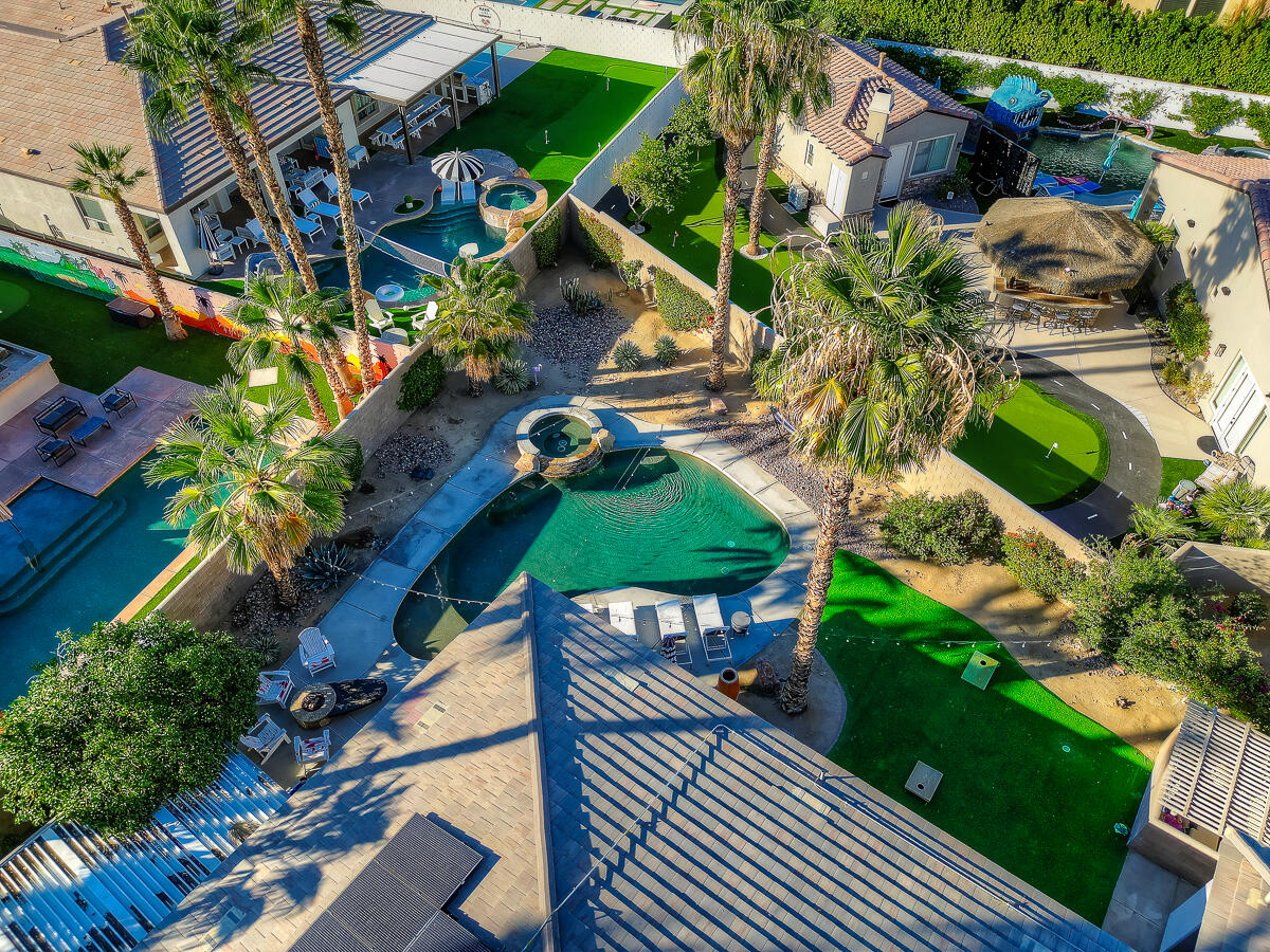 48713 Spring Rain Court Indio, CA 92201 - Photo 63 of 66 a backyard of a house with lots of green space