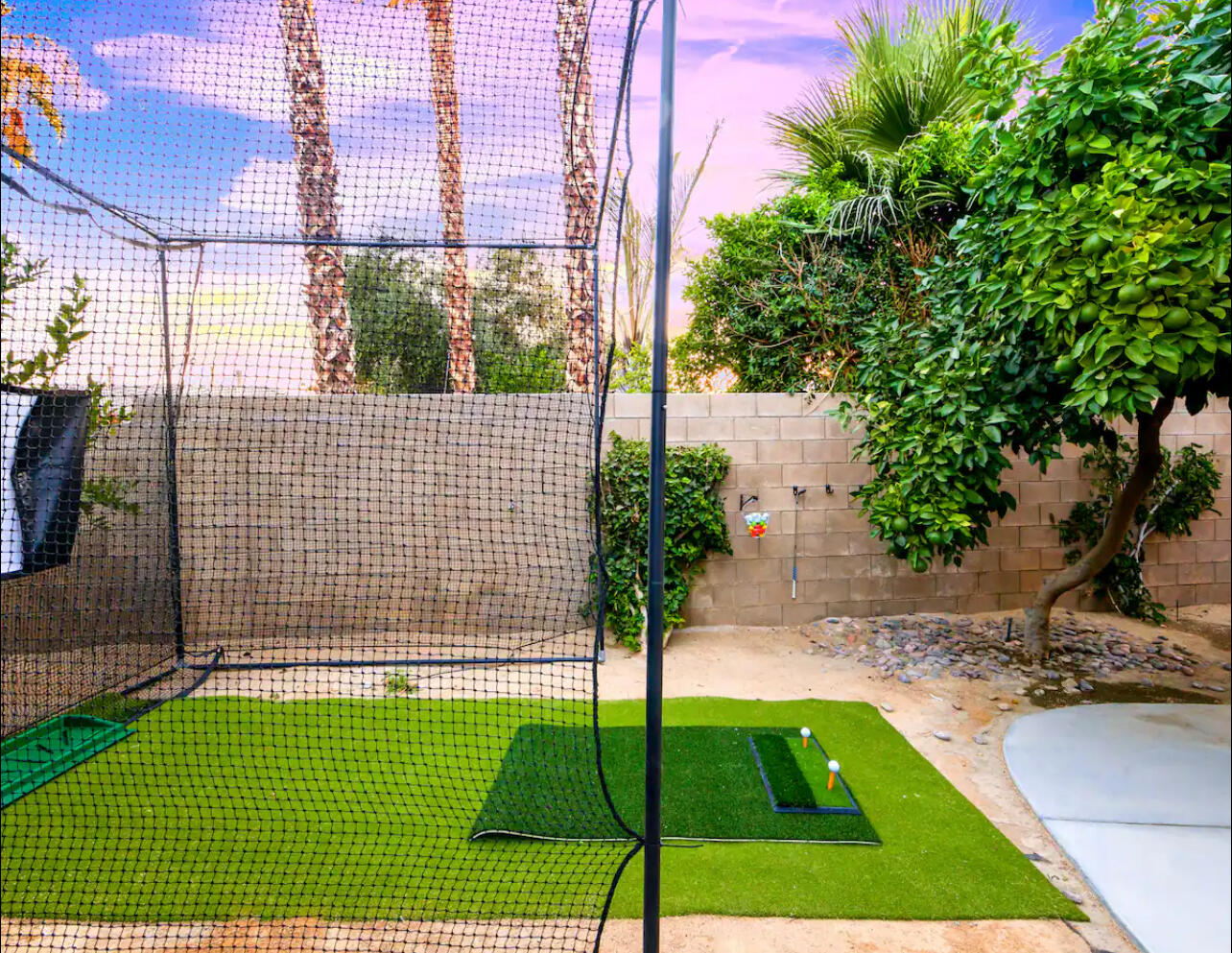 48713 Spring Rain Court Indio, CA 92201 - Photo 9 of 66 a view of backyard with a garden