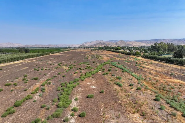 a view of a lake with mountains in the background