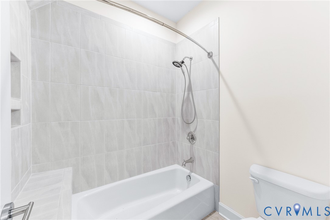 15430 River Road Chesterfield, VA 23838 - Photo 26 of 46 a bathroom with a bathtub and a toilet