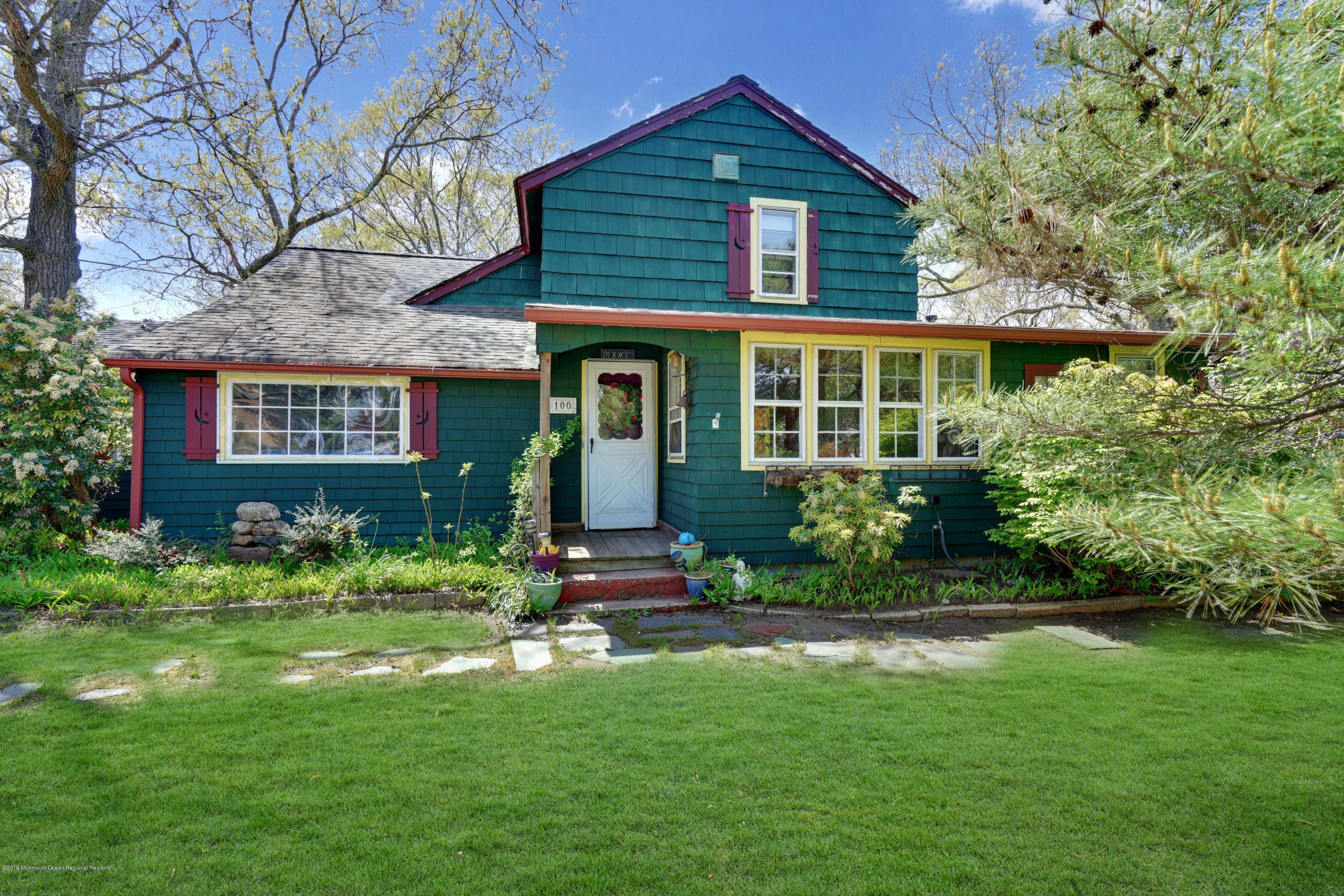 100 Breton Road Brick, NJ 08723 - Photo 1 of 37 a front view of a house with garden