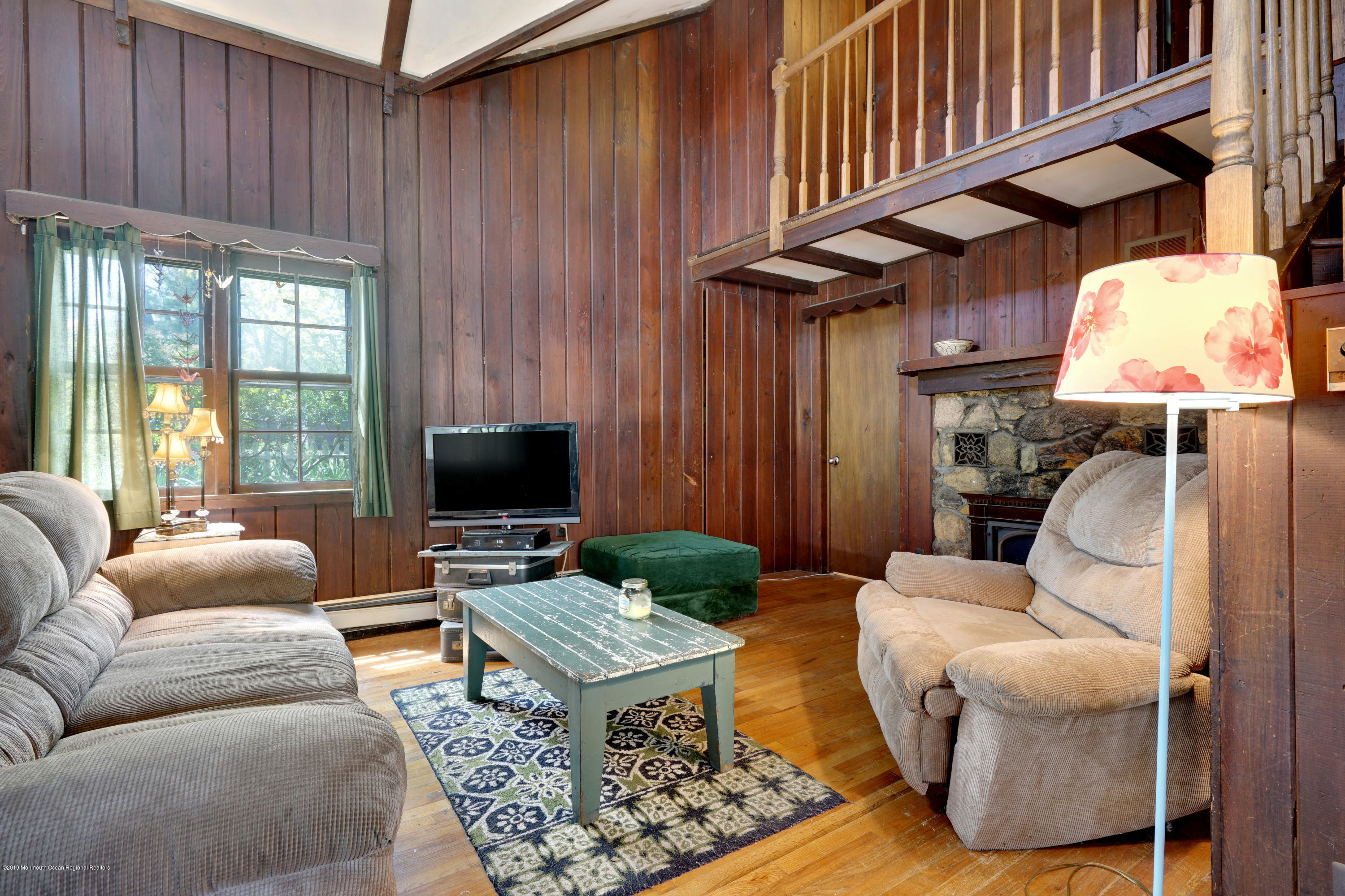 100 Breton Road Brick, NJ 08723 - Photo 13 of 37 a living room with furniture a window and a flat screen tv