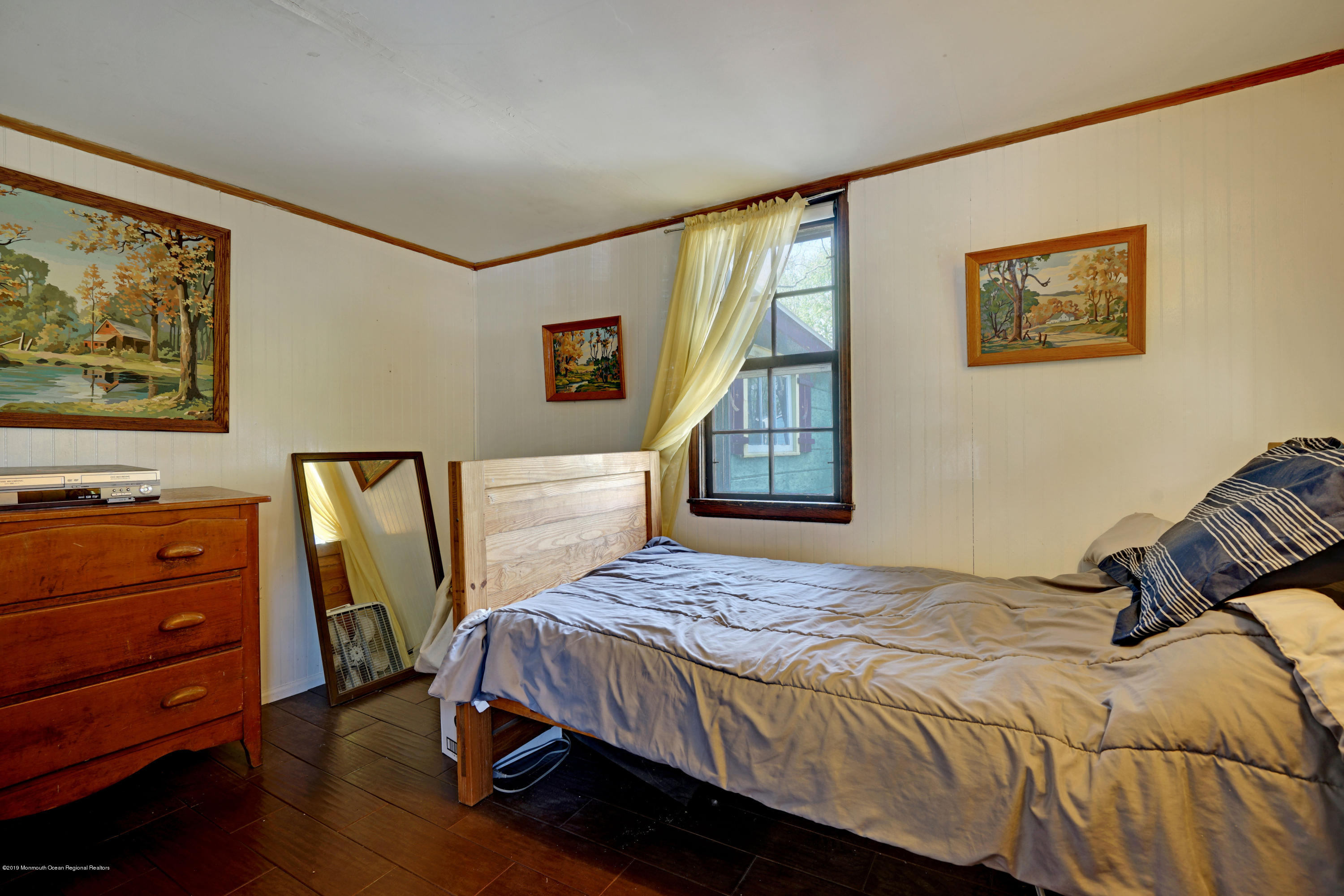 100 Breton Road Brick, NJ 08723 - Photo 18 of 37 a bedroom with a bed and a window