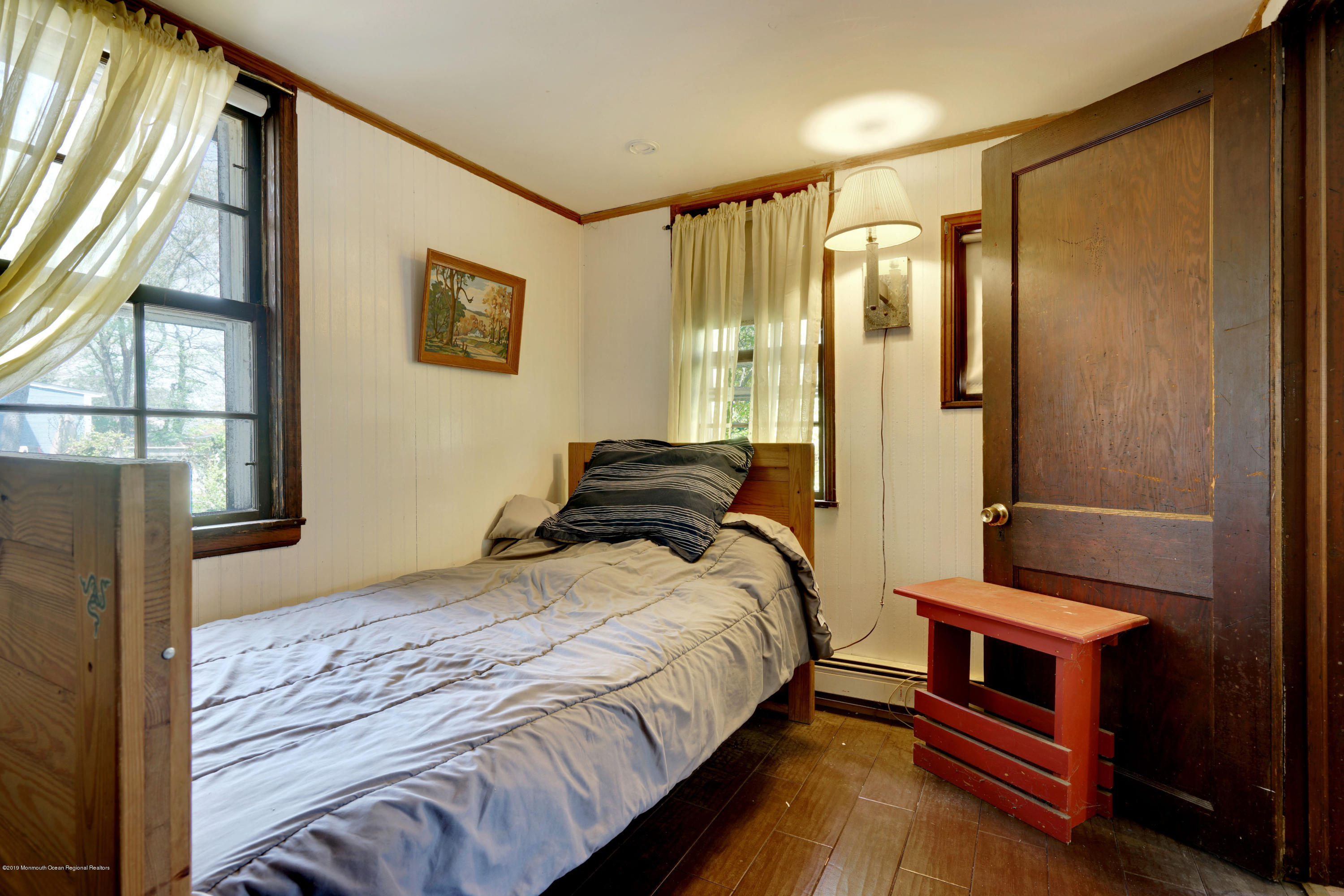 100 Breton Road Brick, NJ 08723 - Photo 19 of 37 a bedroom with a bed and a window