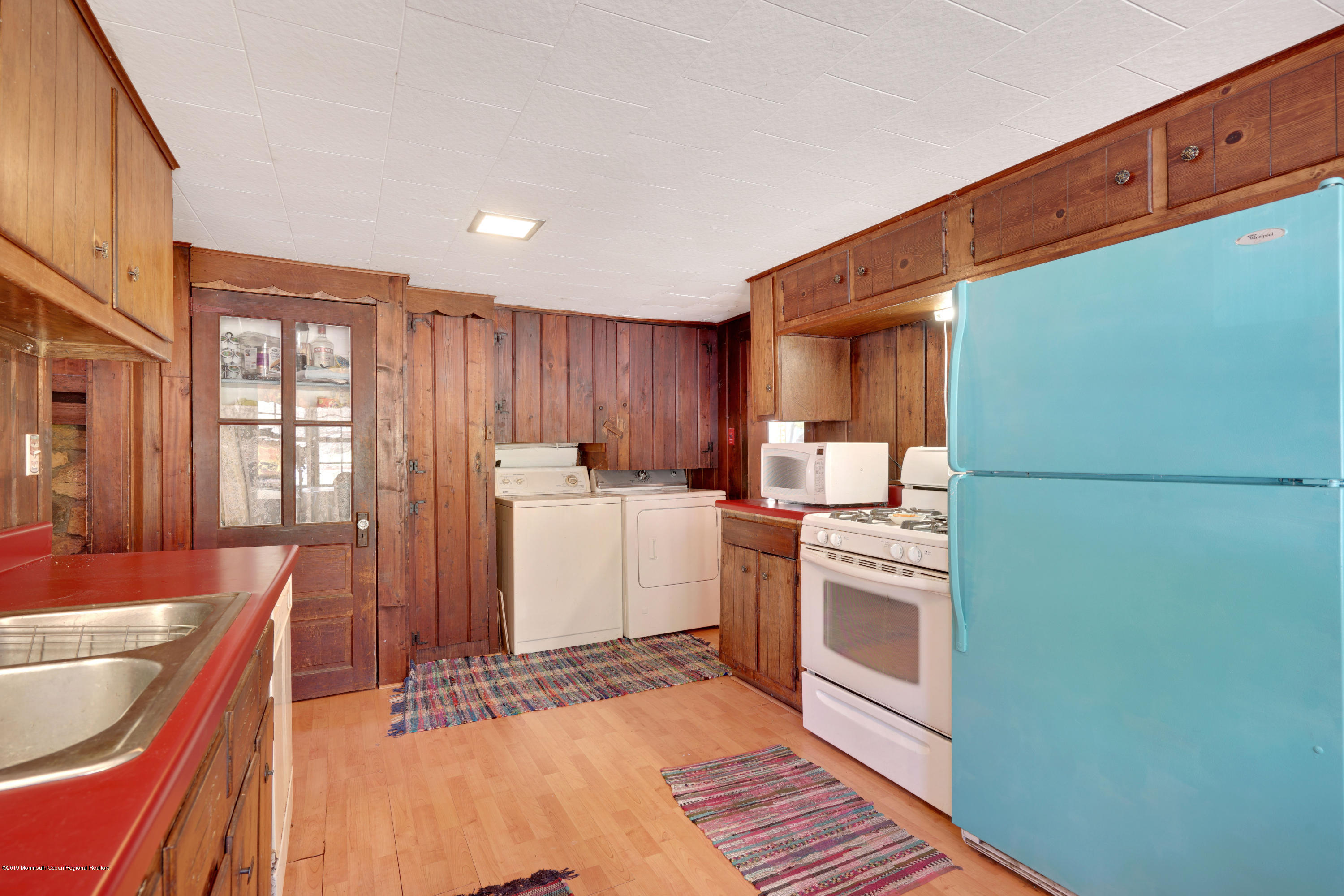100 Breton Road Brick, NJ 08723 - Photo 21 of 37 a kitchen with a sink cabinets and window