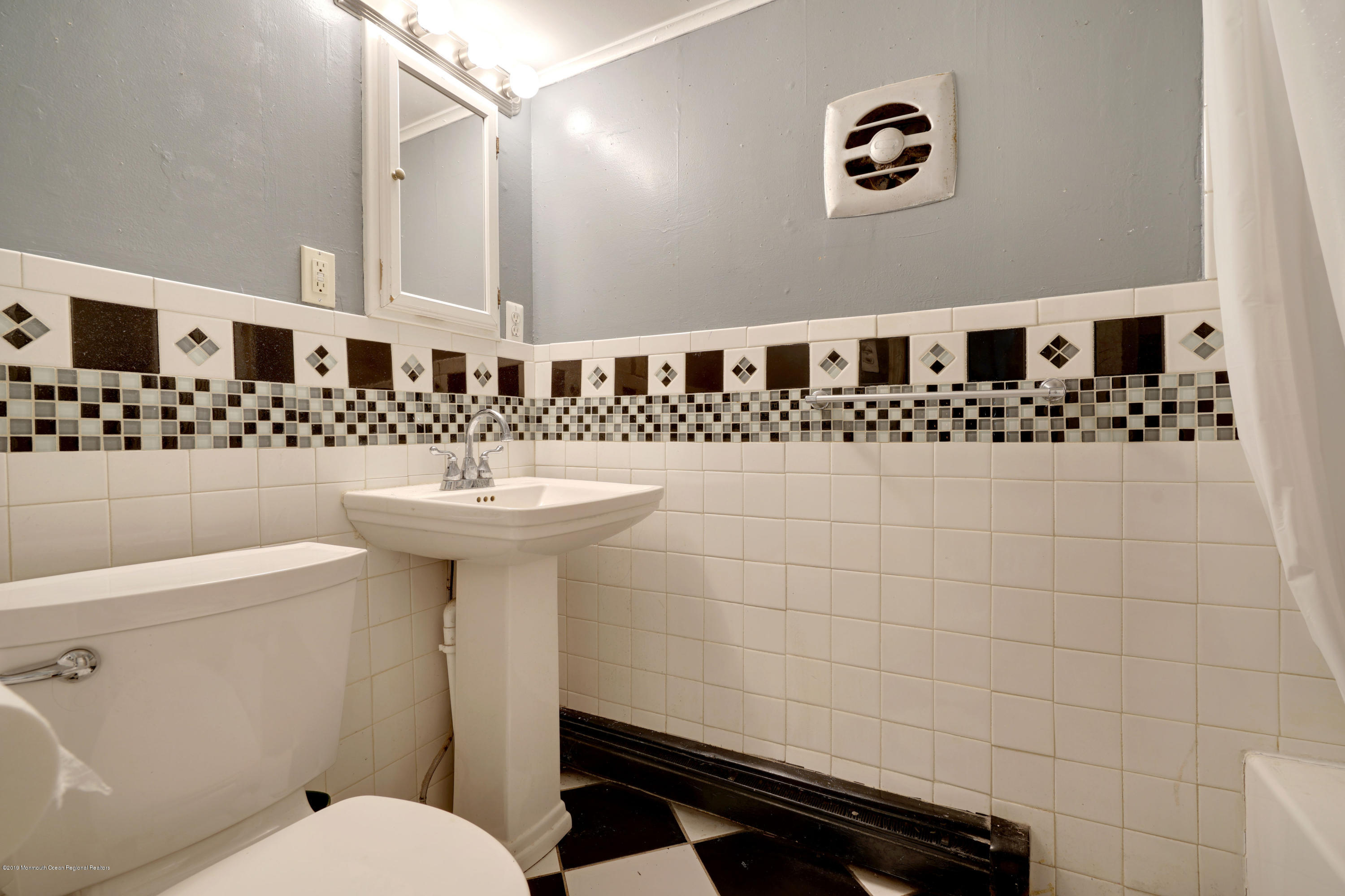 100 Breton Road Brick, NJ 08723 - Photo 22 of 37 a bathroom with a sink toilet and mirror