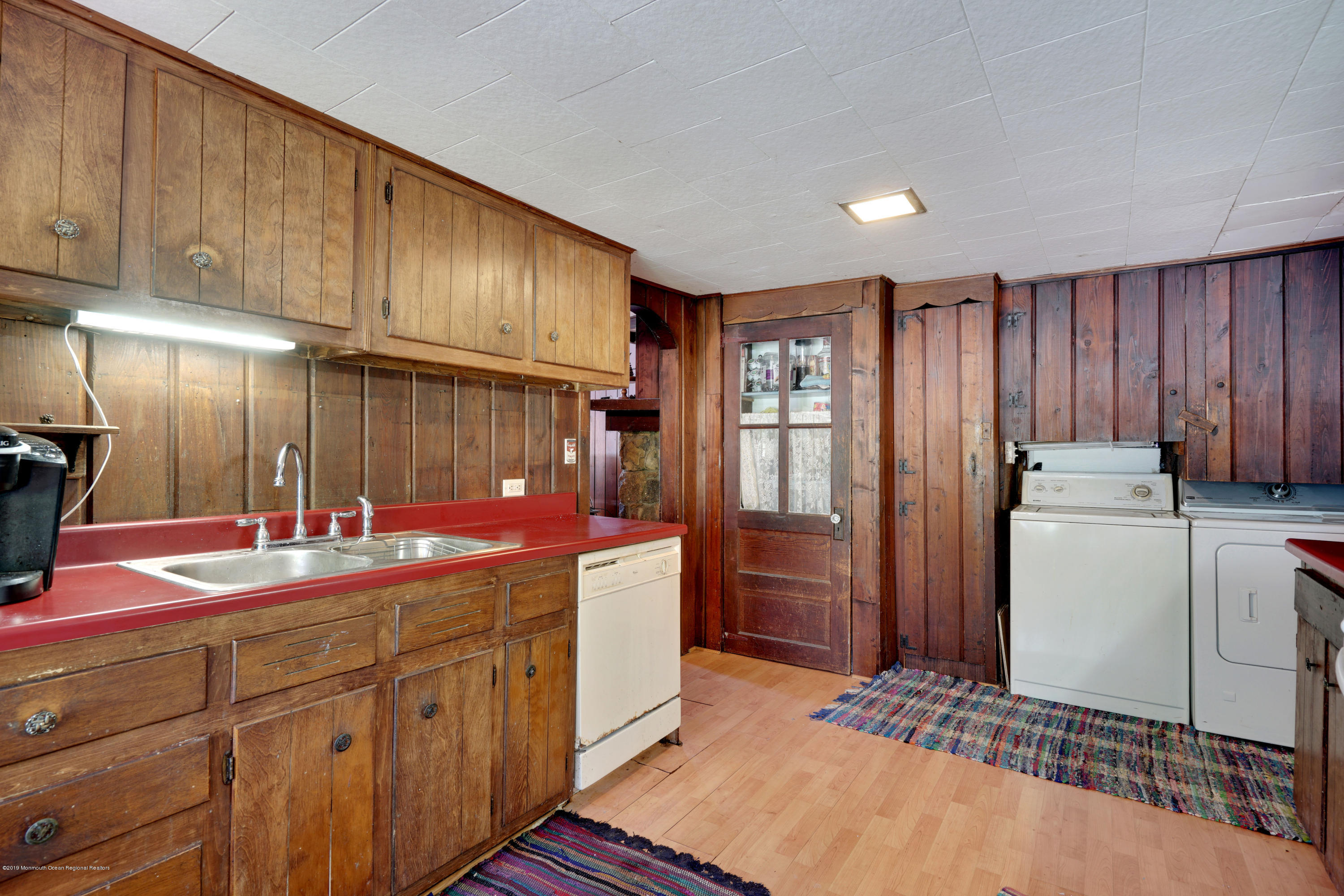 100 Breton Road Brick, NJ 08723 - Photo 27 of 37 a kitchen with kitchen island granite countertop cabinets and refrigerator