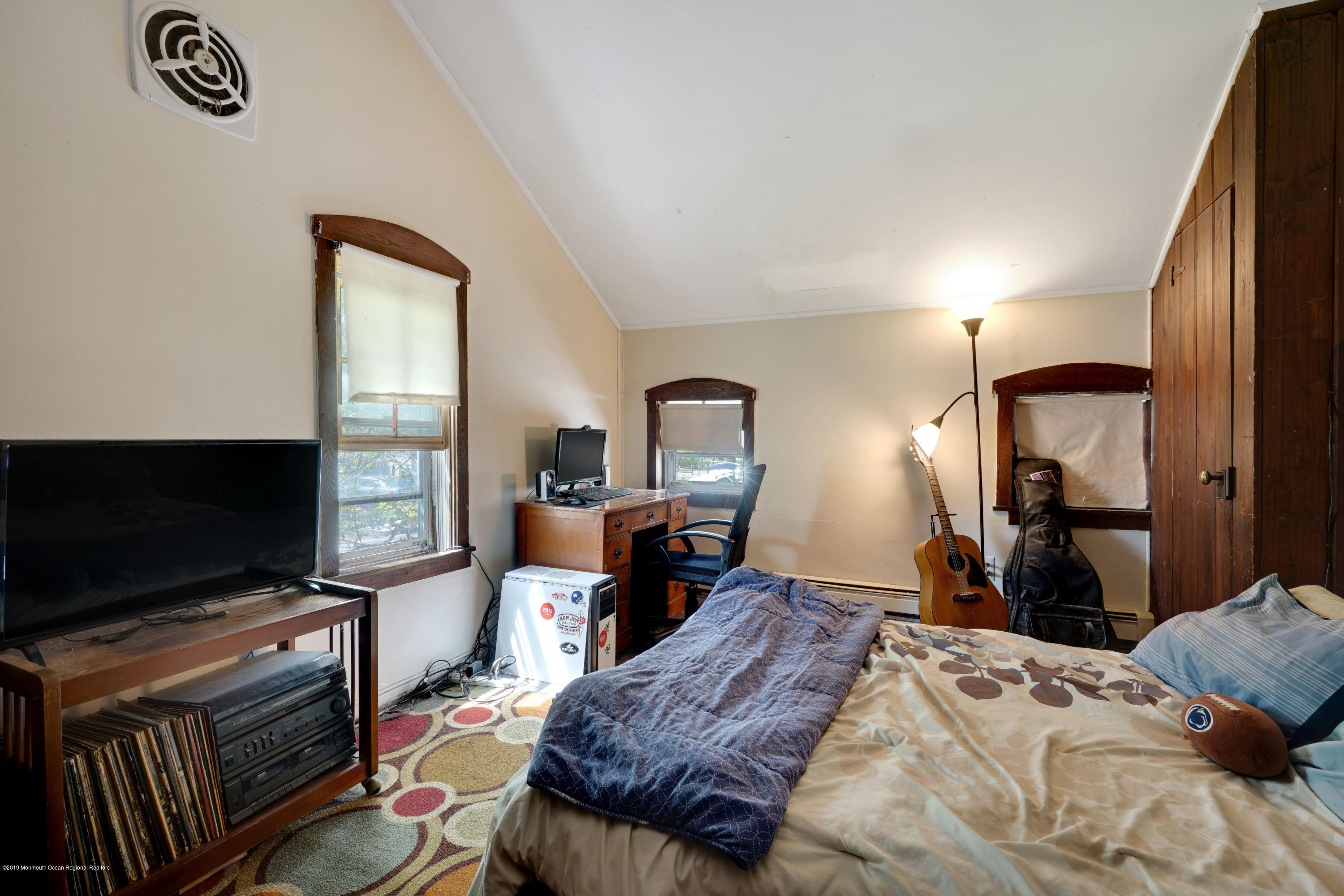 100 Breton Road Brick, NJ 08723 - Photo 33 of 37 a bedroom with a bed and a flat screen tv