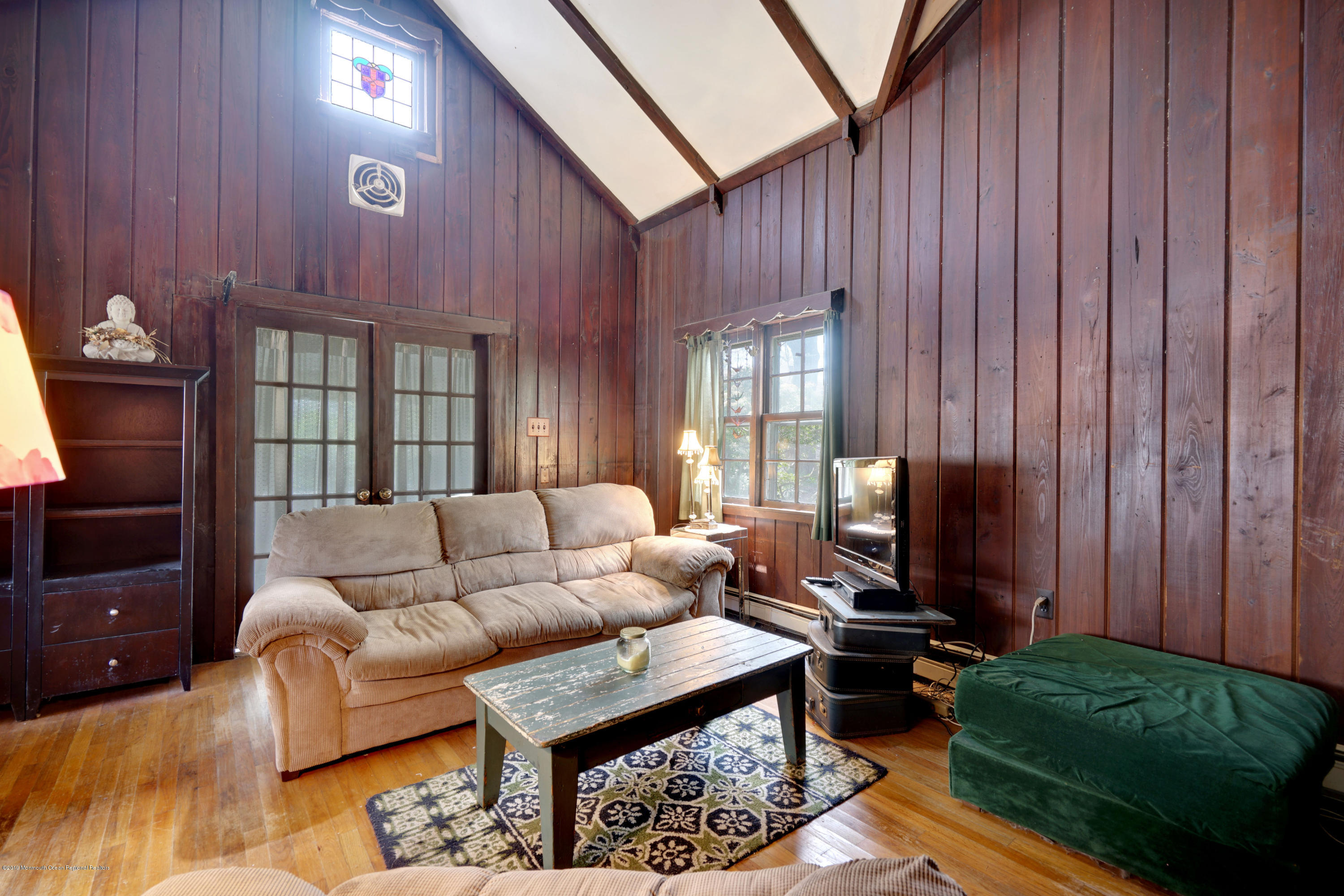 100 Breton Road Brick, NJ 08723 - Photo 7 of 37 a living room with furniture a rug and a window