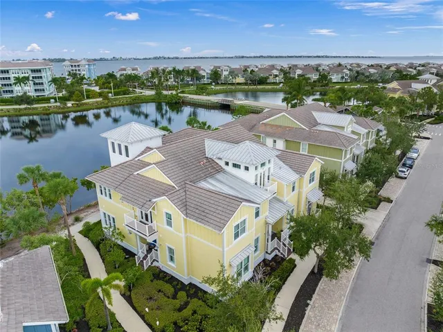 an aerial view of a house with a lake view