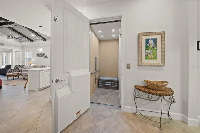 a view of kitchen with furniture and a refrigerator