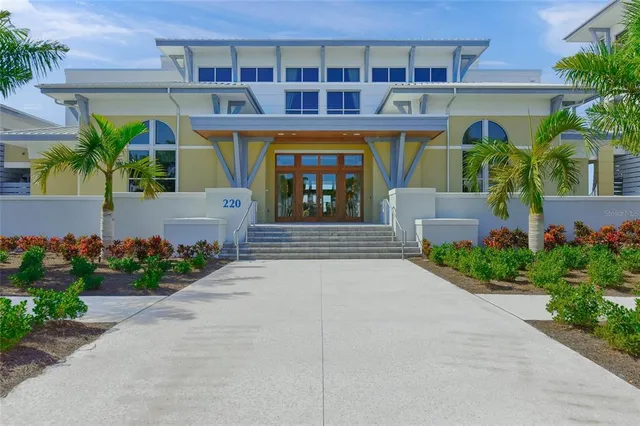 a front view of a building with potted plants