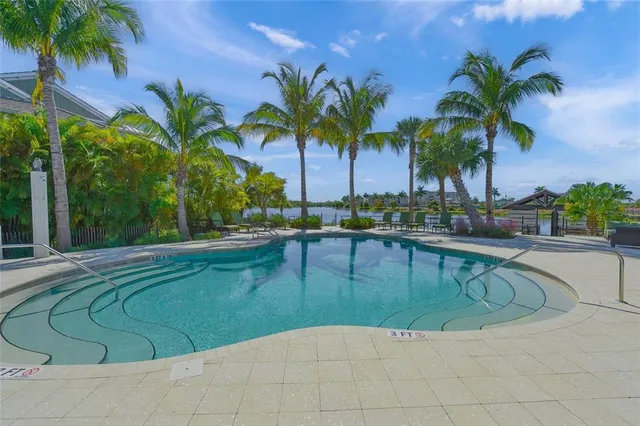 a view of a swimming pool with a table and chairs