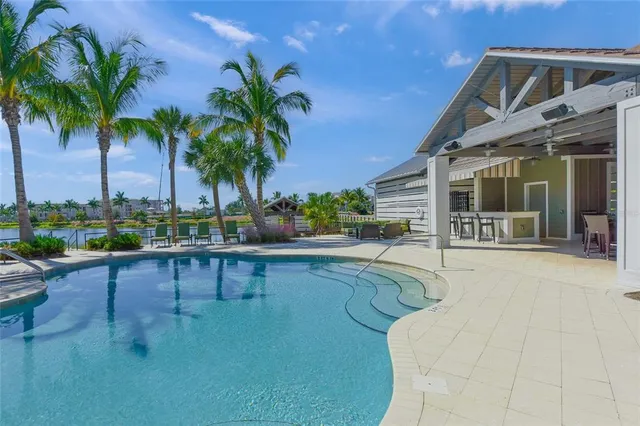 a view of swimming pool having outdoor seating