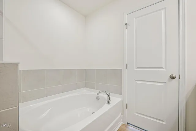 a bathroom with a sink double vanity and a mirror