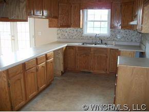 995 Painters Gap Road Rutherfordton, NC 28139 - Photo 3 of 5 a kitchen with sink cabinets and window
