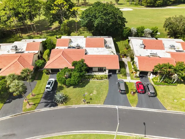 an aerial view of house with yard swimming pool and outdoor seating