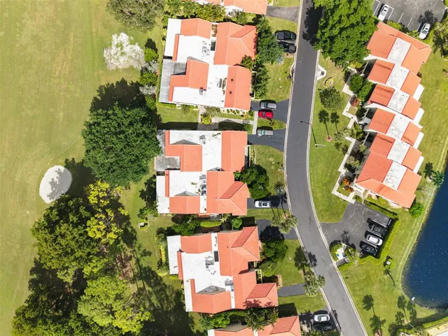 an aerial view of residential house with outdoor space and swimming pool