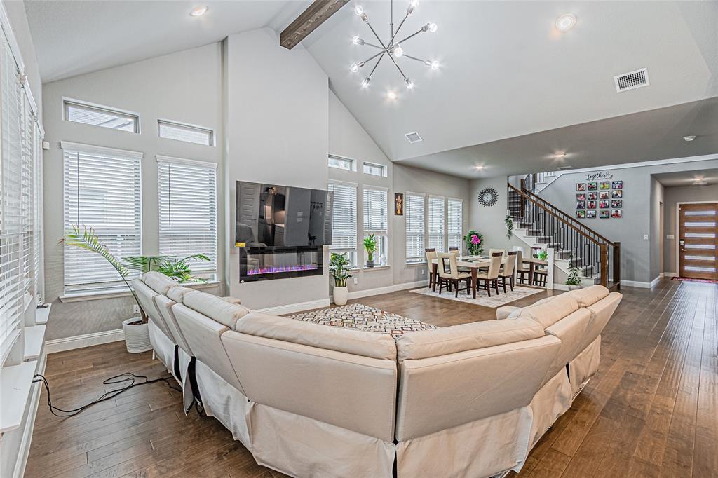 13261 Jonata Street Frisco, TX 75035 - Photo 12 of 40 a living room with furniture and a flat screen tv