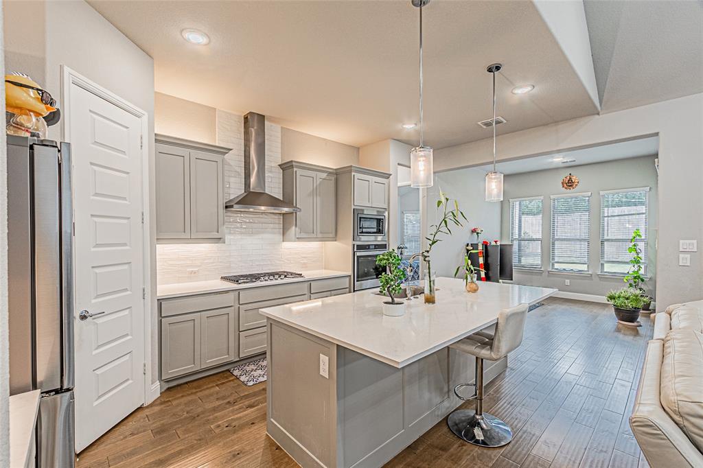 13261 Jonata Street Frisco, TX 75035 - Photo 16 of 40 a kitchen with a sink stainless steel appliances and cabinets