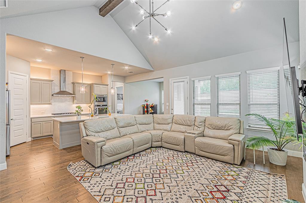 13261 Jonata Street Frisco, TX 75035 - Photo 17 of 40 a living room with furniture and a large window