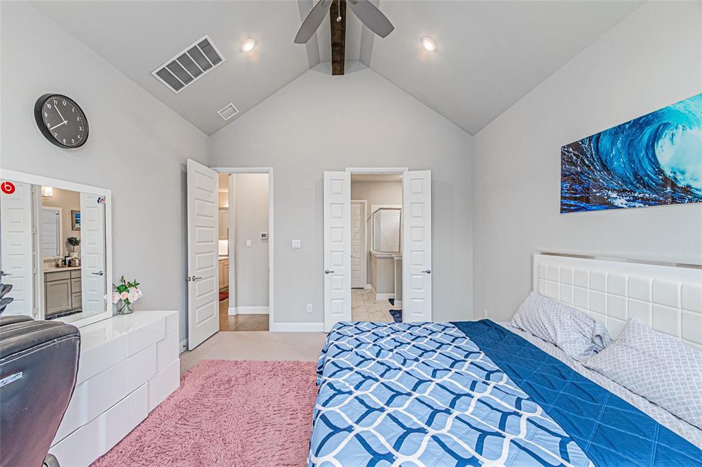 13261 Jonata Street Frisco, TX 75035 - Photo 20 of 40 a bedroom with a bed and a lamp on dresser