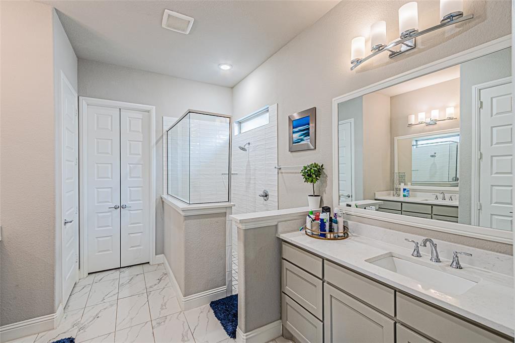 13261 Jonata Street Frisco, TX 75035 - Photo 24 of 40 a bathroom with a double vanity sink mirror and double
