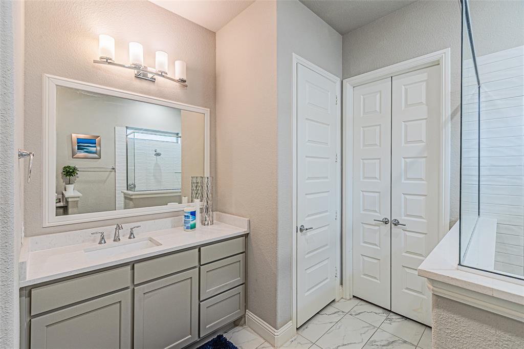 13261 Jonata Street Frisco, TX 75035 - Photo 25 of 40 a bathroom with a double vanity sink and mirror