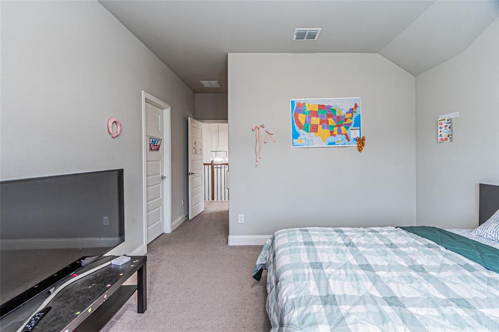 13261 Jonata Street Frisco, TX 75035 - Photo 28 of 40 a bedroom with a bed and a window