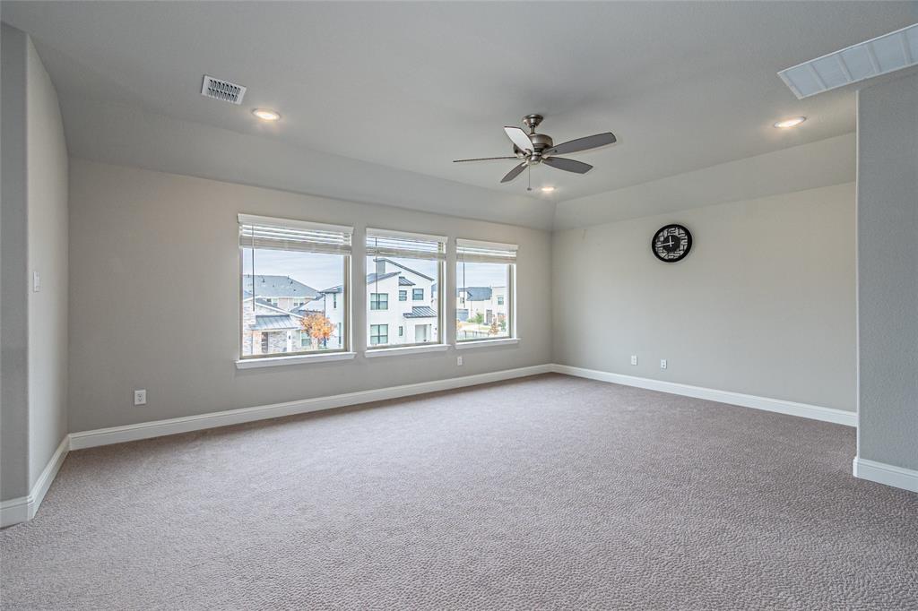 13261 Jonata Street Frisco, TX 75035 - Photo 30 of 40 an empty room with windows and ceiling fan