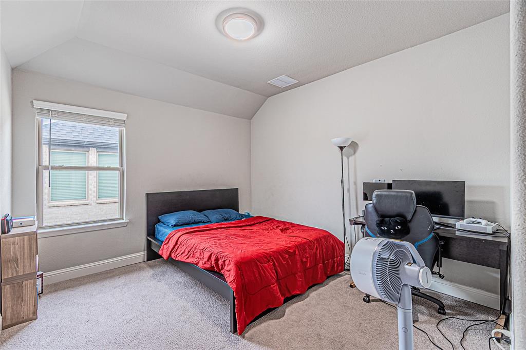 13261 Jonata Street Frisco, TX 75035 - Photo 32 of 40 a bedroom with a bed and wooden floor