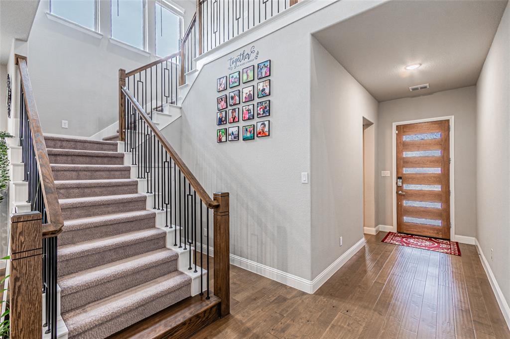 13261 Jonata Street Frisco, TX 75035 - Photo 6 of 40 a view of a hallway with wooden floor and entryway
